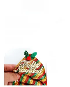 Detail of Christmas headband featuring sequins and Feliz Navidad greeting text