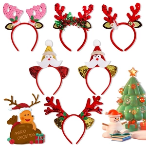 Close-up of festive Christmas headbands with sequins, reindeer antlers and Santa motifs