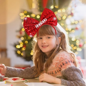 Sparkly red sequin Christmas bow headband with white snowflakes and HO HO HO print for kids