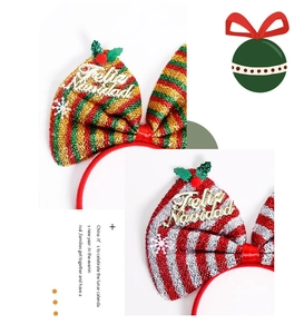 Close-up of Christmas bow headband with Feliz Navidad text and glitter sequins