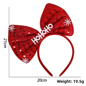 Detail view of red sequin Christmas bow headband with size markings 21cm x 20cm