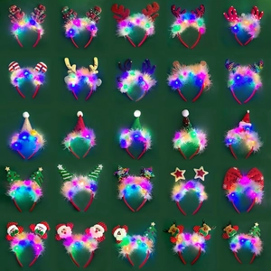 Matrix display of 25 assorted LED Christmas headbands with reindeer antlers and feathers