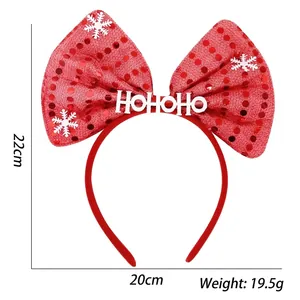 Detailed view of red sequin Christmas bow headband with size marks 22cm and 20cm