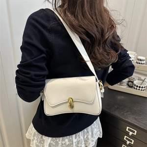 Minimalist white leather shoulder bag with vintage gold swivel lock and adjustable strap