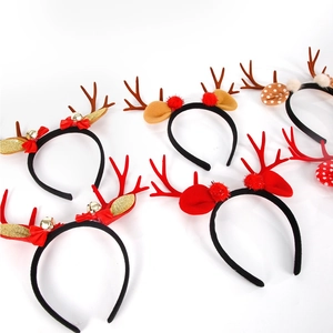 Flat lay of assorted Christmas reindeer antler headbands with bells and pom poms