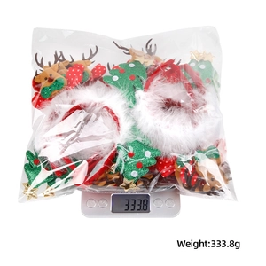 A bulk pack of Christmas headbands with LED lights on a scale weighing 333.8 grams