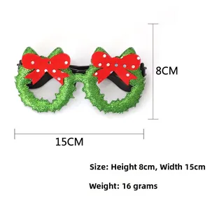 Macro detail of green glitter Christmas glasses with red bows and product dimensions