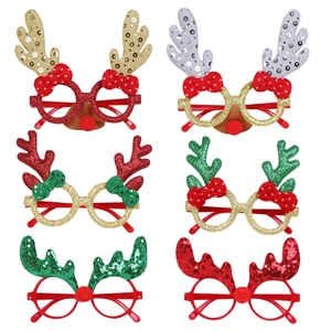 Detail of 6-pack Christmas glasses featuring gold glitter reindeer antlers and red bows