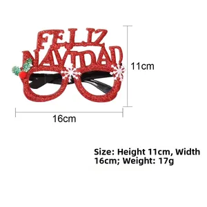 Detail of red glitter Christmas glasses with Feliz Navidad text and snowflake accents