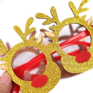 Lunettes de Noël avec bois de renne dorés scintillants et montures rouges de fête