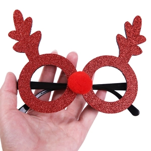 Detail of Christmas reindeer glasses with red glitter finish and a soft plush nose ball