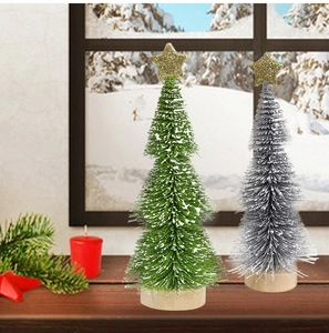Miniature flocked Christmas trees with wooden bases and gold stars for desktop decor