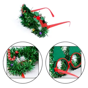 Christmas reindeer glasses with green tinsel garland and festive holiday decorations