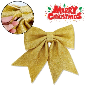Glittery gold Christmas bow ornament for tree decoration with convenient twist tie