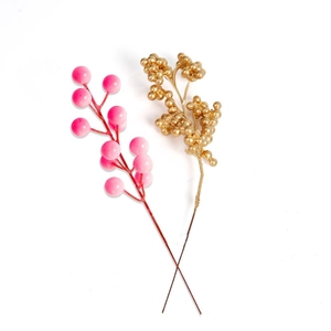 Artificial pink and metallic gold Christmas berry stems for festive DIY tree decoration