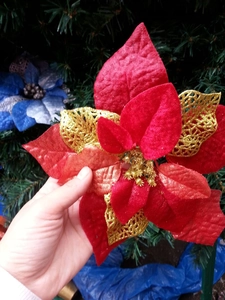 Close-up of 20cm red velvet artificial Christmas flower with gold glitter details