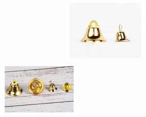 Detailed macro view showing internal tongue structure of gold-tone metal bell ornaments