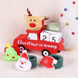 Close-up of plush Christmas slap bracelets featuring Santa, Reindeer, and Tree designs