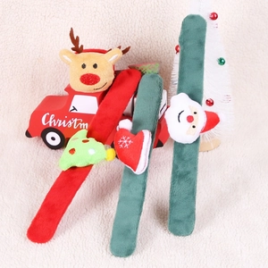 Detailed close-up of plush Christmas slap bracelets with reindeer and Santa decorations