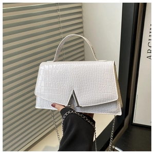Detail of white crocodile embossed mini square bag with silver A-shaped metal buckle
