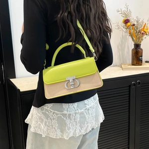 Modern neon green and beige woven crossbody bag with artistic silver metallic clasp