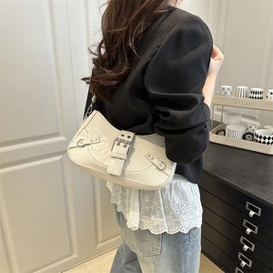 White croc-effect baguette bag with silver hardware and chic Y2K moto-style aesthetics