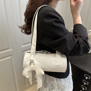 Minimalist white cylindrical underarm bag with an elegant bow accent for women