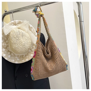 Detailed knit texture of crochet tote bag with colorful sunflower floral patterns