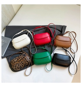 Mini crossbody saddle bags in six colors including leopard print and bright green