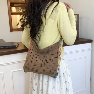 Bohemian handmade crochet crossbody bag with colorful granny square floral patterns