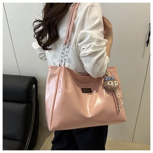 Pink glossy patent leather tote bag with silver chain strap and fashion logo detail