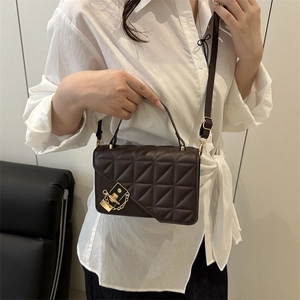Quilted dark brown crossbody bag with gold square buckle and leather shoulder strap