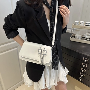 Minimalist white leather square crossbody bag with dual straps and silver metal chain detail