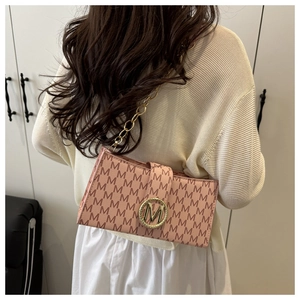 Pink shoulder bag with 'M' logo print and golden chain strap shown on a model