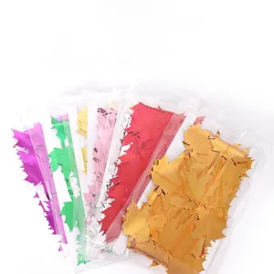 Detail of colorful metallic maple leaf fringe curtains in multiple vibrant festival colors