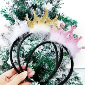 Set of three glitter crown headbands with white feathers for birthday parties