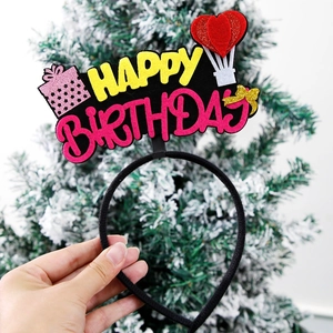 Detail of colorful Happy Birthday felt headband with gift and balloon decorations