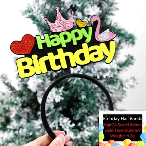 Close-up of kids birthday headband with pink crown, swan, and Happy Birthday text