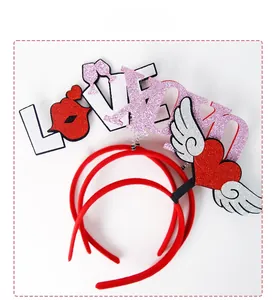 Close-up of Valentine party headbands with glittery LOVE letters and red lip motifs