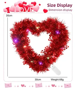 Detail showing 30x30cm red heart tinsel wreath dimensions with colorful LED lights