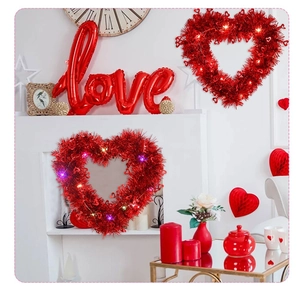 Detail of red tinsel heart wreaths with colorful LED lights for Valentine decor