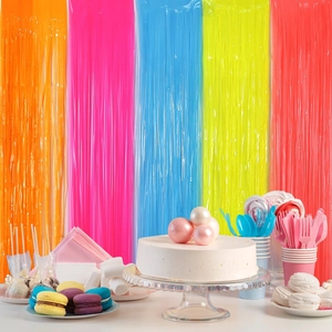 Colorful tinsel foil fringe curtains for birthday party backdrops and festive decor