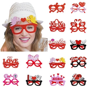 Valentine's Day party glasses set with red glitter hearts and XOXO frames for photo props
