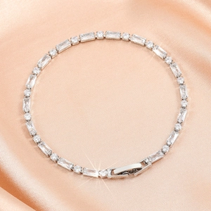 Elegant silver tennis bracelet with sparkling rectangular and round cubic zirconia stones