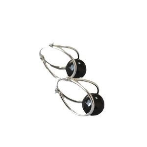 Minimalist silver double loop earrings featuring a polished black bead geometric design