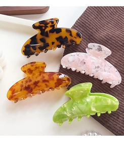 Large acetate hair claws set in tortoiseshell, amber, pink marble and green marble
