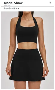 Slim fit premium black yoga set featuring racerback crop top and high-waist athletic skirt