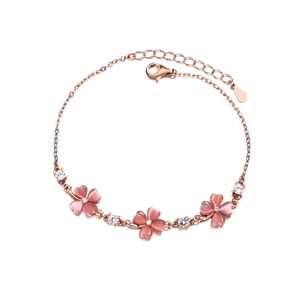 Rose gold clover bracelet featuring pink stones and sparkling cubic zirconia stones