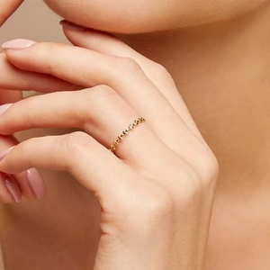 Minimalist 925 sterling silver olive leaf ring with gold finish worn on finger