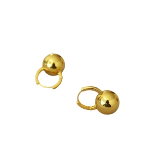 Minimalist gold hoop earrings with polished spherical beads on a white background